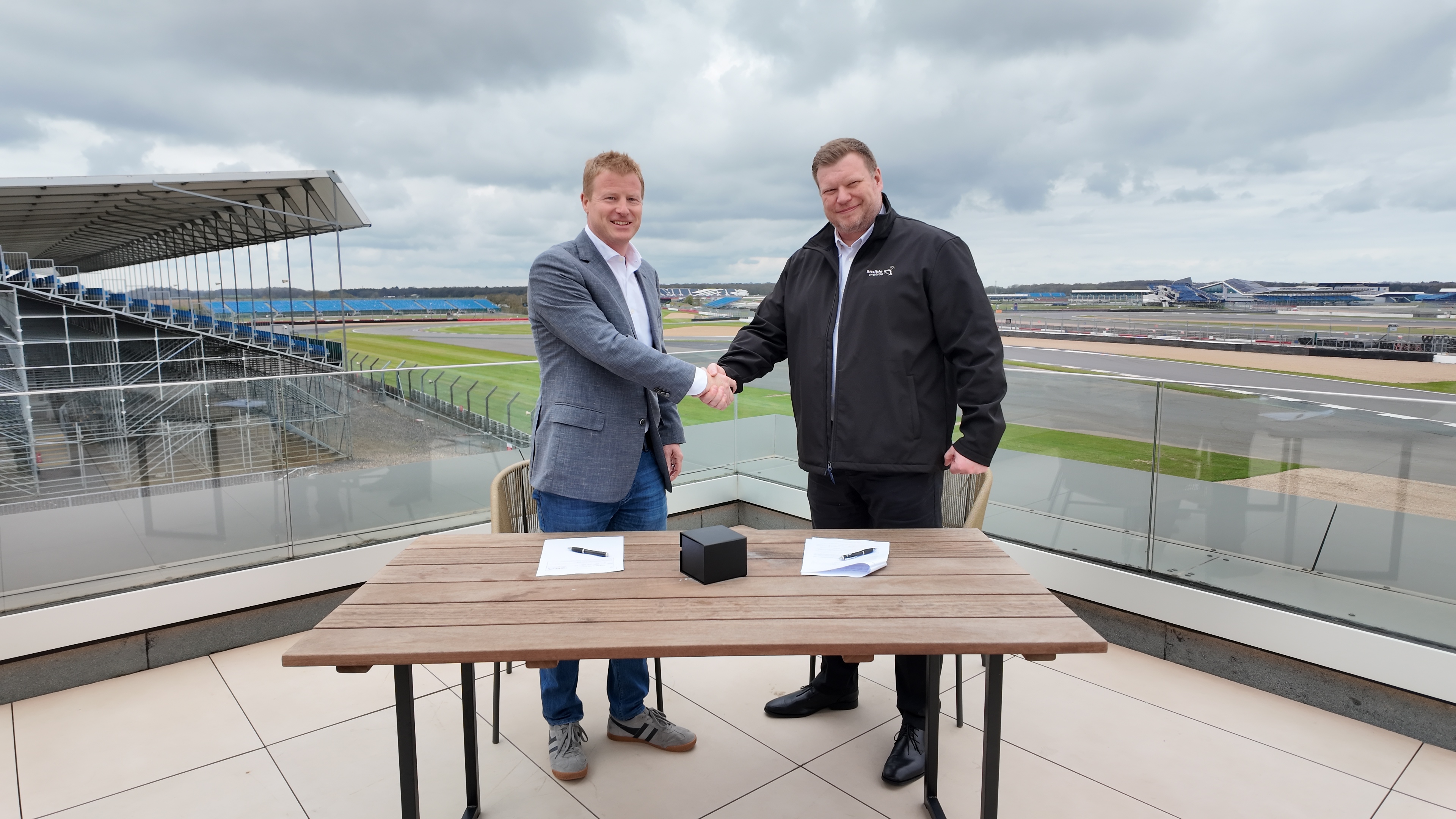 Till Bechtolsheimer (Lola Cars) and Dan Clark (Ansible Motion), signing partnership agreement at Silverstone.JPG